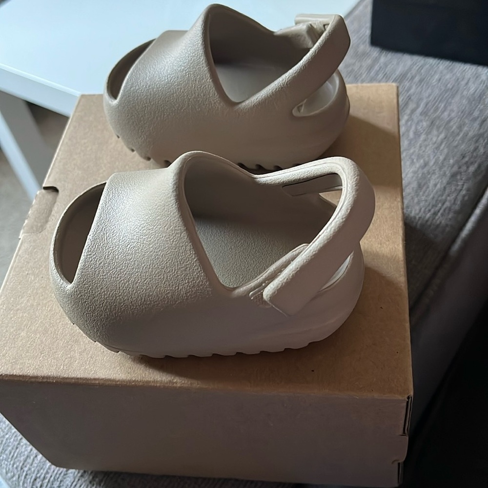 Baby Yeezy slides.